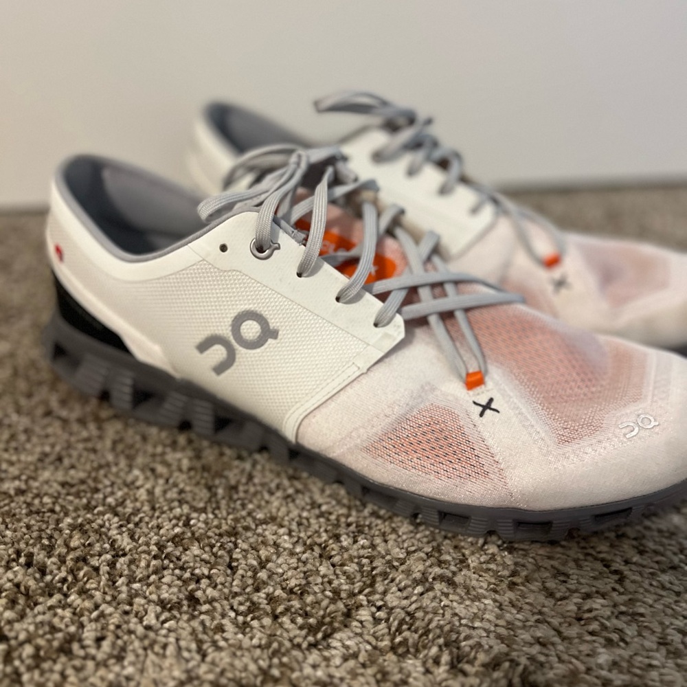 On Running White and Gray Shoes with Orange Detail